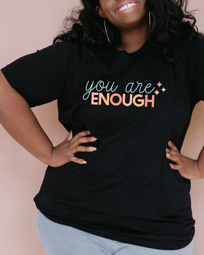 Front of a model wearing a size Large You Are Enough Stars in Black by Simply Sage Market. | dia_product_style_image_id:281640